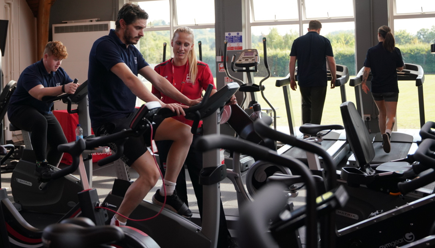 People using equipment in a gym