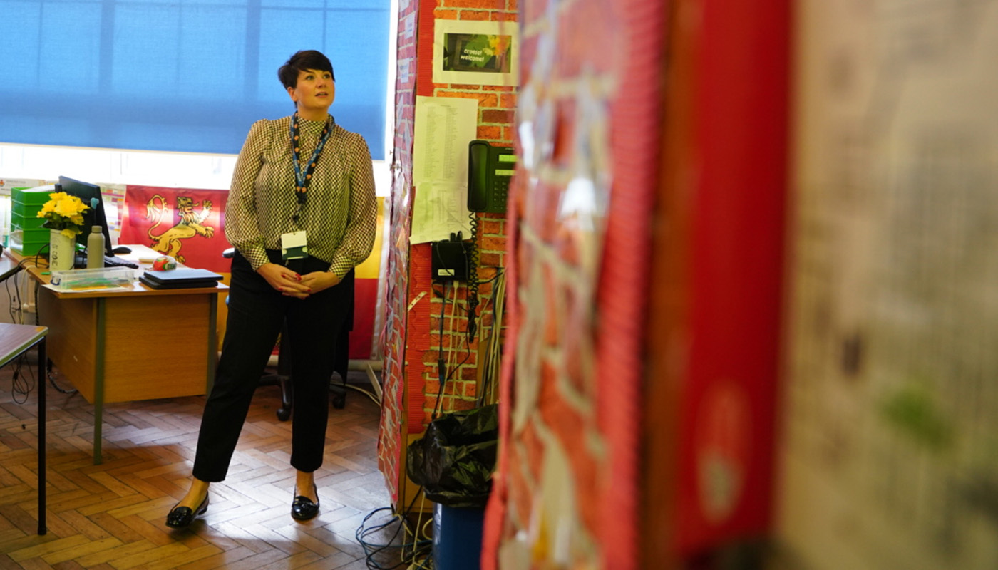 A teacher standing at the front of a classroom