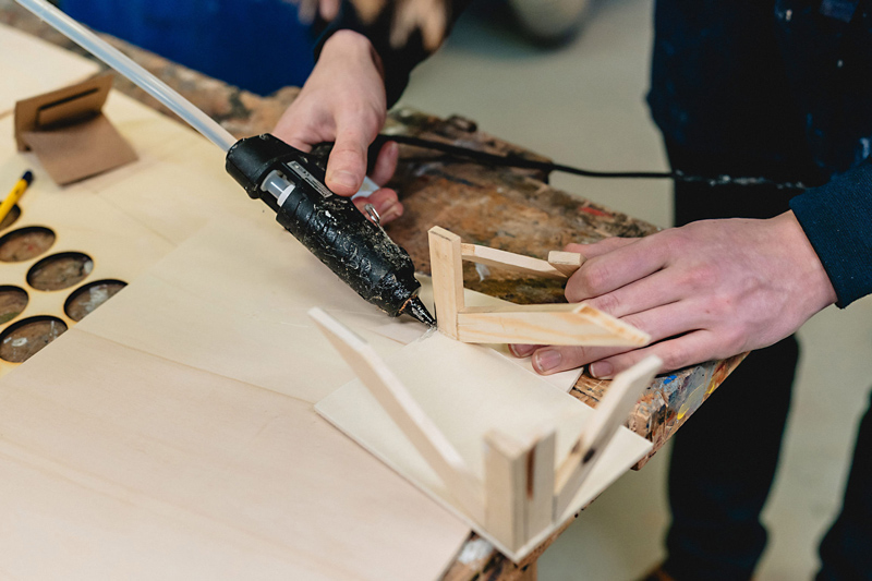 Hands using woodworking tools